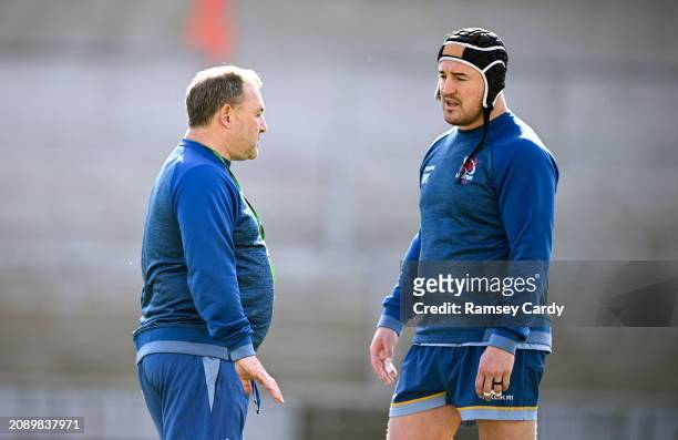 Northern Ireland , United Kingdom - 19 March 2024; Interim head coach Richie Murphy, left, in conversation with Rob Herring during Ulster Rugby squad...