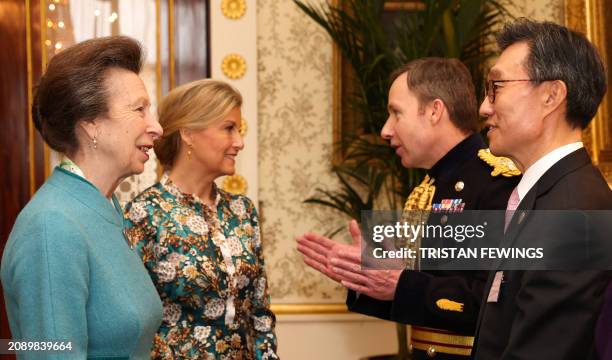 Britain's Princess Anne, Princess Royal and Britain's Sophie, Duchess of Edinburgh talk with Major General Eldon Millar and South Korea's Ambassador...