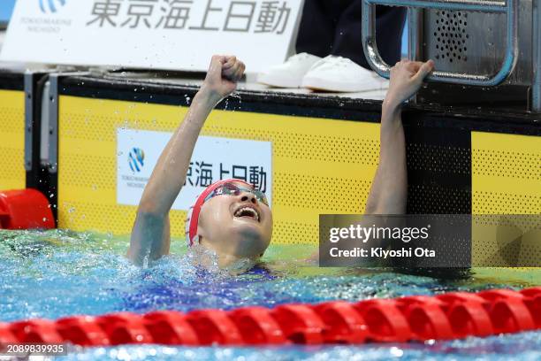 Mio Narita reacts after winning the Women's 400m Individual Medley Final during day three of the Swimming Olympic Qualifier at Tokyo Aquatics Centre...