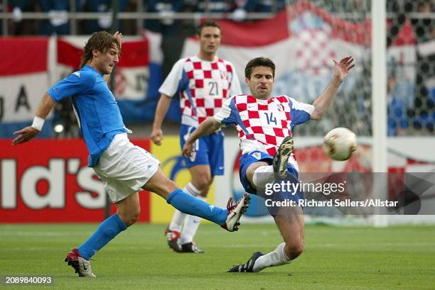 June 8: Zvonimir Soldo of Croatia and Francesco Totti of Italy challenge during the FIFA World Cup Finals 2002 Group G match between Italy and...