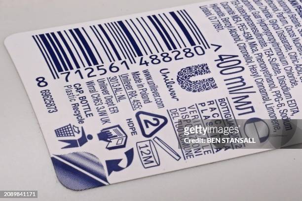 Photograph taken on March 19, 2024 shows the logo of British consumer goods giant Unilever on a Dove's shampoo bottle. Unilever said on March 19,...