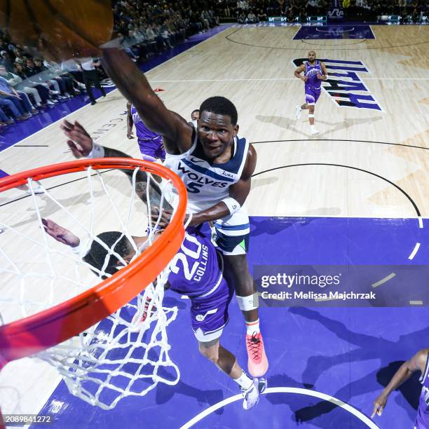 Anthony Edwards of the Minnesota Timberwolves dunks the ball against the Utah Jazz on March 18, 2024 at Delta Center in Salt Lake City, Utah. NOTE TO...