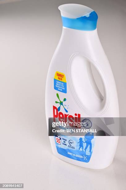 Photograph taken on March 19, 2024 shows a Persil's laundry detergent bottle, a brand part of the British consumer goods giant Unilever. Unilever...