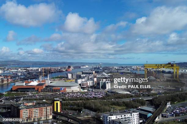 An aerial view shows the River Lagan in Belfast, Northern Ireland on March 19, 2024 looking out towards the docklands area of the city. The port and...