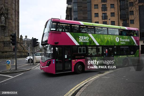 Zero emissions double decker bus is driven in central Belfast, Northern Ireland, on March 19, 2024.
