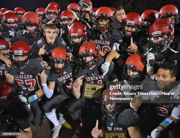 Glens Falls players celebrate their team win in the Class B state semifinal football game against Pleasantville at Dietz Stadium Saturday Nov. 19,...