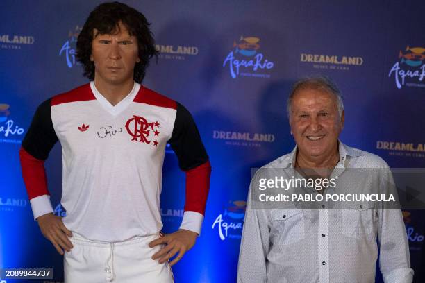 Brazilian former footballer Zico poses next to his wax statue after its inauguration at the AquaRio's Wax Museum in Rio de Janeiro, on March 19, 2024.