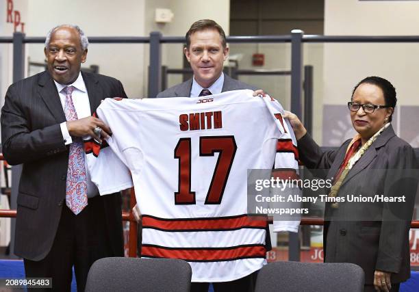 Director of athletics, Dr. Lee McElroy Jr., left, and RPI president Shirley Ann Jackson, right, welcome Dave Smith as RPI's new men's hockey coach...