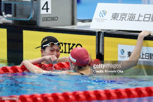 Ageha Tanigawa reacts with Mio Narita after finishing second in the Women's 400m Individual Medley Final during day three of the Swimming Olympic...
