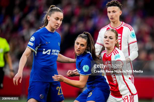 Eve Perisset of Chelsea and Milicia Keijzer of AFC Ajax challenge during the UEFA Women's Champions League 2023/24 Quarter Final Leg One match...