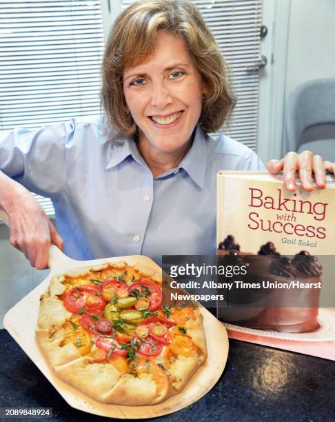 Gail Sokol, chef educator at Schenectady County Community College, with an heirloom tomato tart from her new cookbook, "Baking with Success" in her...