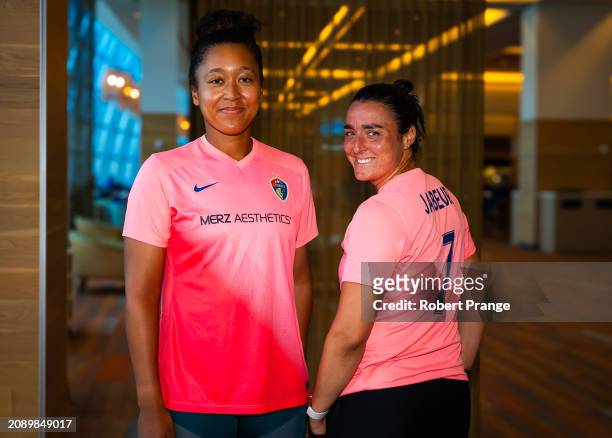 Naomi Osaka of Japan and Ons Jabeur of Tunisia pose in North Carolina Courage jerseys on Day 4 of the Miami Open Presented by Itau at Hard Rock...