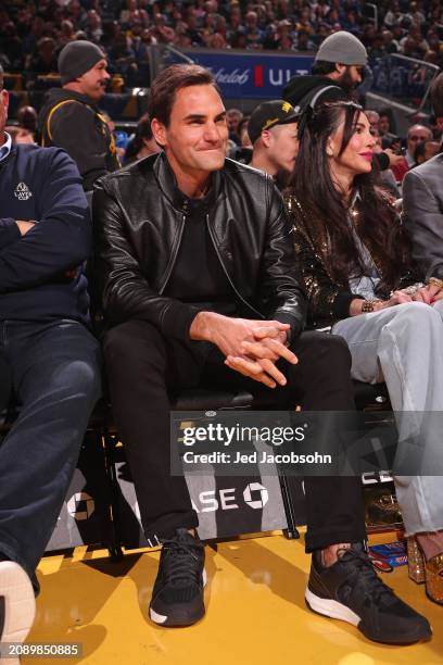 Roger Federer and Nicole Curran attend the game between the San Antonio Spurs and the Golden State Warriors on March 9, 2024 at Chase Center in San...