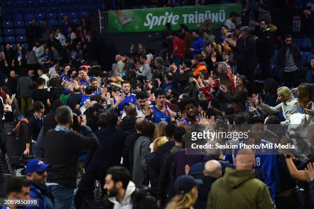 Players of Anadolu Efes Istanbul victory celebrates with fans after the Turkish Airlines EuroLeague Regular Season Round 30 match between Anadolu...