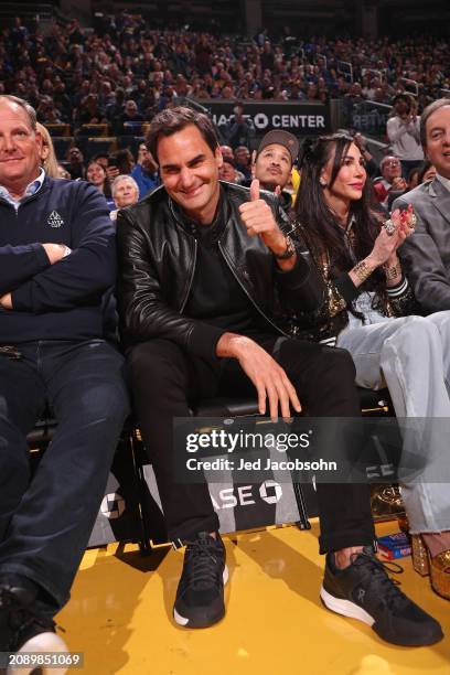 Roger Federer and Nicole Curran attend the game between the San Antonio Spurs and the Golden State Warriors on March 9, 2024 at Chase Center in San...