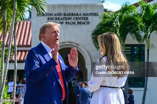 Former US President and Republican presidential candidate Donald Trump and former First Lady Melania Trump arrive to vote in Florida's primary...