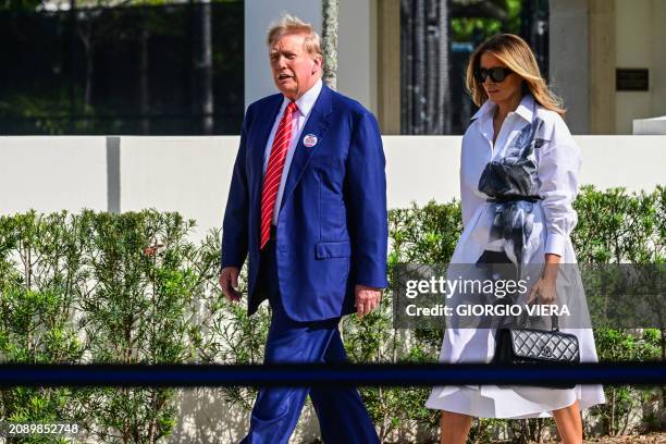 Former US President and Republican presidential candidate Donald Trump and former First Lady Melania Trump leave after voting in Florida's primary...