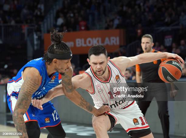 Kostas Papanikolau of Olympiakos and Will Clyburn of Anadolu Efes compete during the Turkish Airlines Euroleague 30th week match between Anadolu Efes...