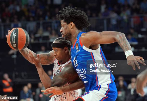 Isaiah Canaan of Olympiakos and Daniel Akinfayoshe Oturu of Anadolu Efes compete during the Turkish Airlines Euroleague 30th week match between...