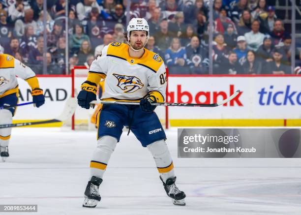 Tommy Novak of the Nashville Predators skates during first period action against the Winnipeg Jets at Canada Life Centre on March 13, 2024 in...
