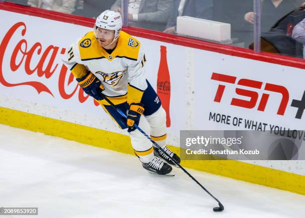 Gustav Nyquist of the Nashville Predators plays the puck during second period action against the Winnipeg Jets at Canada Life Centre on March 13,...