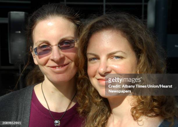 Clare, left, and Sara Bronfman, right, poses for a photo after speaking at a news conference to discuss the schedule of events for the Dalai Lama's...