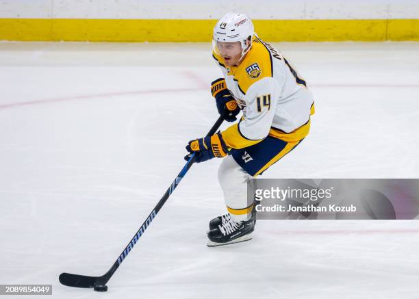 Gustav Nyquist of the Nashville Predators plays the puck during second period action against the Winnipeg Jets at Canada Life Centre on March 13,...