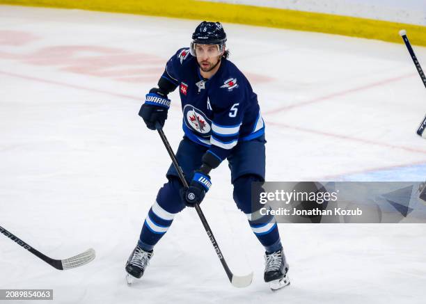 Brenden Dillon of the Winnipeg Jets skates during third period action against the Nashville Predators at Canada Life Centre on March 13, 2024 in...