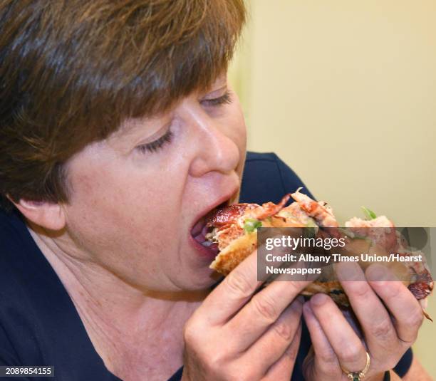 Guest judge Lisa Ribeiro of Albany participates in a comparison tasting of lobster rolls from four local restaurants Wednesday August 1, 2018 in...