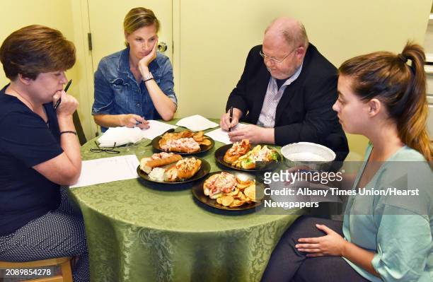 Judges at the Times Union conduct a comparison tasting of lobster rolls from four local restaurants Wednesday August 1, 2018 in Colonie, NY.