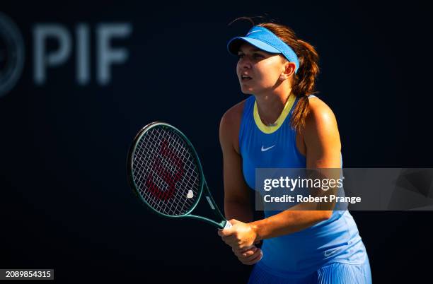 Simona Halep of Romania in action against Paula Badosa of Spain in the first round on Day 4 of the Miami Open Presented by Itau at Hard Rock Stadium...