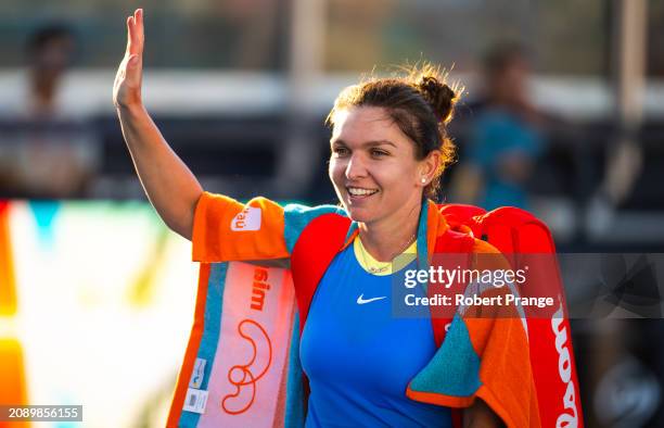Simona Halep of Romania walks off the court after losing to Paula Badosa of Spain in the first round on Day 4 of the Miami Open Presented by Itau at...