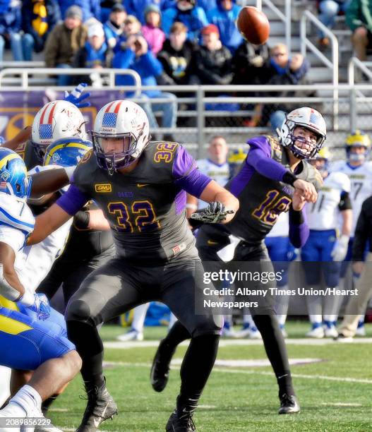 UAlbany QB Jeff Undercuffler lets loose a pass protected by Greig Stire during Saturday's Colonial Athletic Association game against Delaware Nov. 3,...
