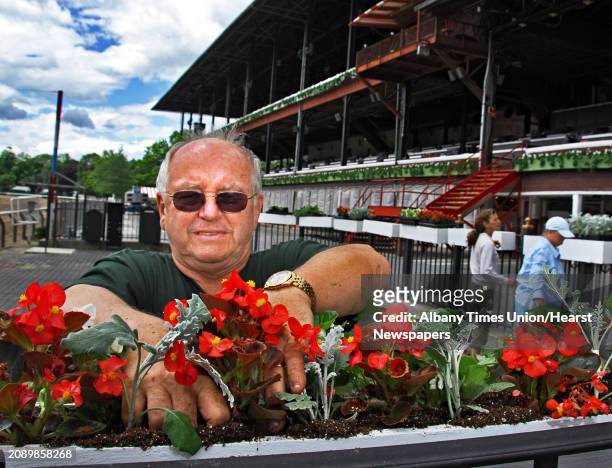 Times Union staff photo by John Carl D'Annibale: Charles "Dude" Dehn of Dehn Flowers in Saratoga Springs, places flowers, begonias and dusty miller...