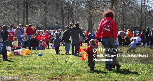 Times Union staff photo by John Carl D'Annibale: Some of the hundreds and hundreds lined up to participate in the annual trout stocking program at...