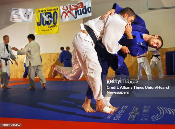 Times Union staff photo by John Carl D'Annibale: Students of U.S. Olympic judo coach Jason Morris, Travis Stevens, far right, of Scotia, and Bill...