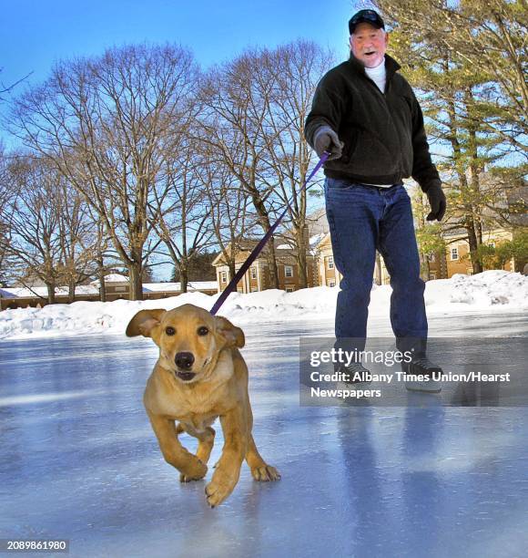 Jeff Strack of Glens Falls ice skates with puppy, "Lily" at Saratoga Spa State Park in Saratoga Springs Tuesday February 24, 2009.