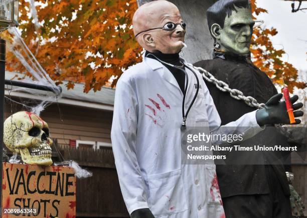 Halloween display has Frankenstein's monster about to get a flu shot on the front lawn of a Pinewoods Ave home in Troy Tuesday October 27, 2009.