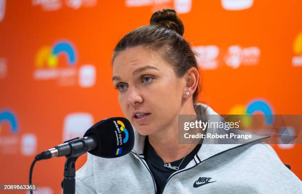 Simona Halep of Romania talks to the media after losing to Paula Badosa of Spain in the first round on Day 4 of the Miami Open Presented by Itau at...