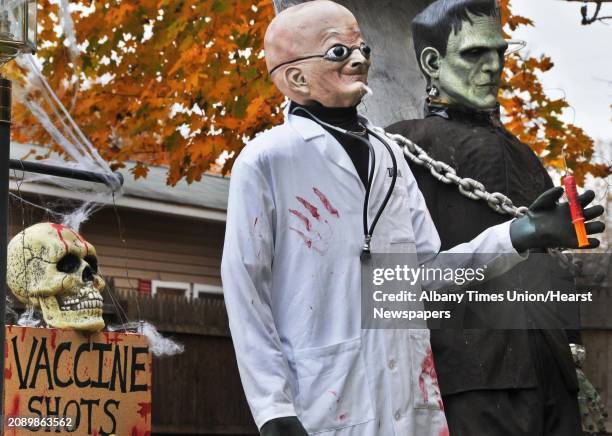 Halloween display has Frankenstein's monster about to get a flu shot on the front lawn of a Pinewoods Ave home in Troy Tuesday October 27, 2009.