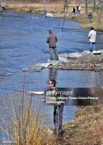 Keith Solomon of Scotia casts a nymph for brown trout on a Kayaderosseras Creek crowded with opening day fisherman at William Kelley Park in Ballston...