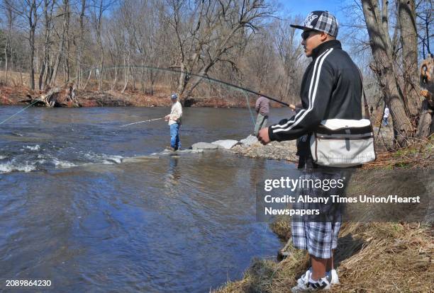 Bobby Babarta of Ballston Spa casts a dry fly rising brown trout on a Kayaderosseras Creek crowded with opening day fisherman at William Kelley Park...