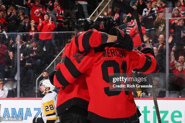 Dawson Mercer of the New Jersey Devils celebrates his goal with teammates in the third period of the game against the Pittsburgh Penguins at the...