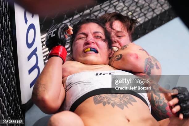 Macy Chiasson submits Pannie Kianzad of Iran in their women's bantamweight fight during the UFC Fight Night event at UFC APEX on March 16, 2024 in...