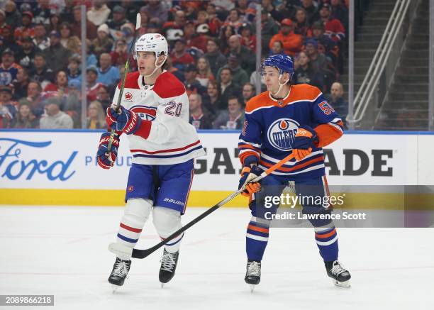 Troy Stecher of the Edmonton Oilers shadows Juraj Slafkovsky of the Montreal Canadiens in the first period on March 19, 2024 at Rogers Place in...