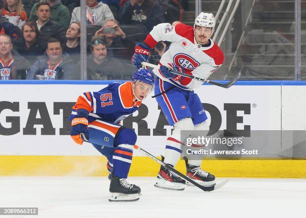 Arber Xhekaj of the Montreal Canadiens makes a pass by Troy Stecher of the Edmonton Oilers in the first period on March 19, 2024 at Rogers Place in...