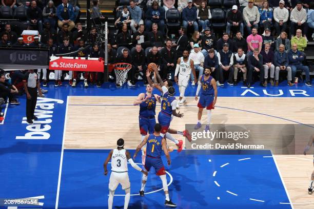 Kentavious Caldwell-Pope of the Denver Nuggets blocks the shot by Kyle Anderson of the Minnesota Timberwolves during the game on March 19, 2024 at...