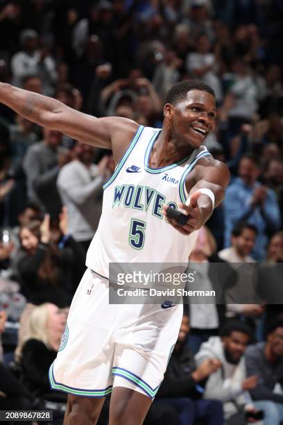 Anthony Edwards of the Minnesota Timberwolves smiles during the game against the Denver Nuggets on March 19, 2024 at Target Center in Minneapolis,...