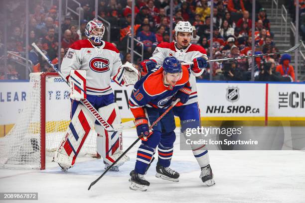 Montreal Canadiens Defenceman Arber Xhekaj cross checks Edmonton Oilers Right Wing Zach Hyman in front of the net in the first period of the Edmonton...