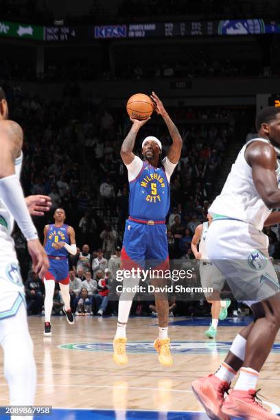 Kentavious Caldwell-Pope of the Denver Nuggets shoots the ball during the game against the Minnesota Timberwolves on March 19, 2024 at Target Center...